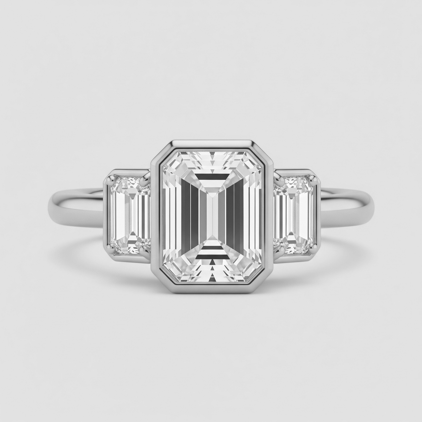 Bague trilogie émeraude serti clos