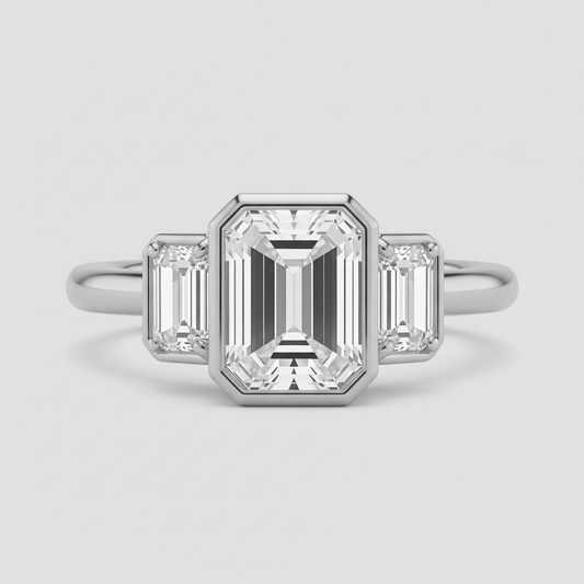 Bague trilogie émeraude serti clos